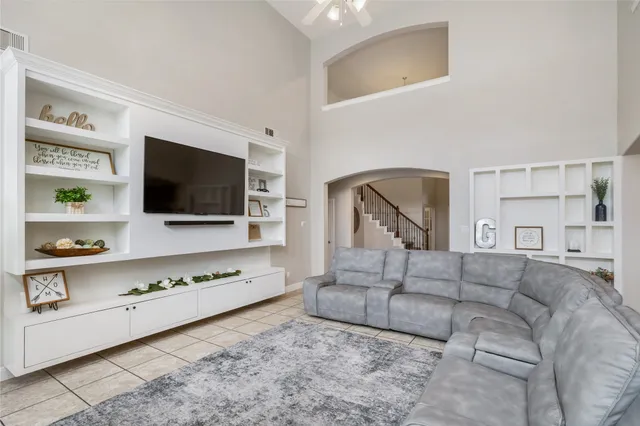 a living room with furniture and a rug