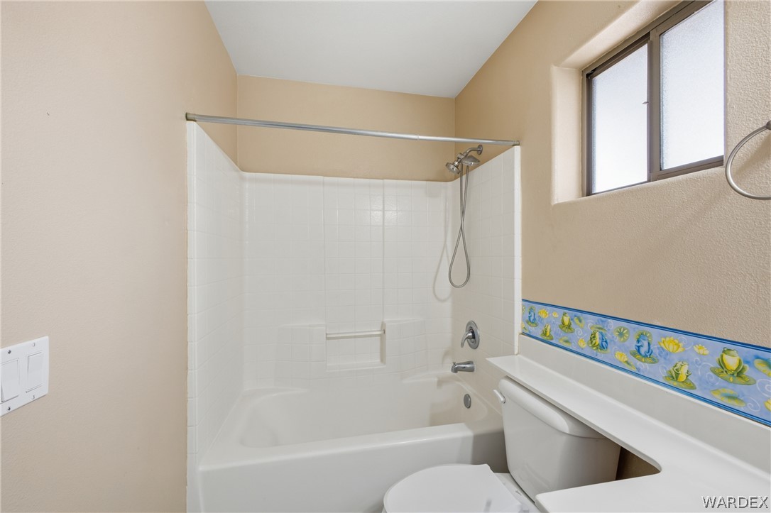 3918 North Eagle Rock Road Kingman, AZ 86409 - Photo 21 of 44 a bathroom with a bathtub and a shower