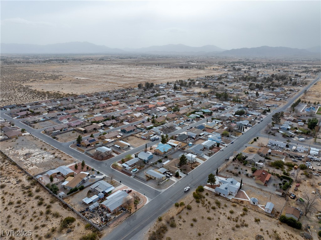 633 East Simkins Road Pahrump, NV 89060 - Photo 22 of 25 Bird's eye view featuring a residential view, a desert view, and a mountain view
