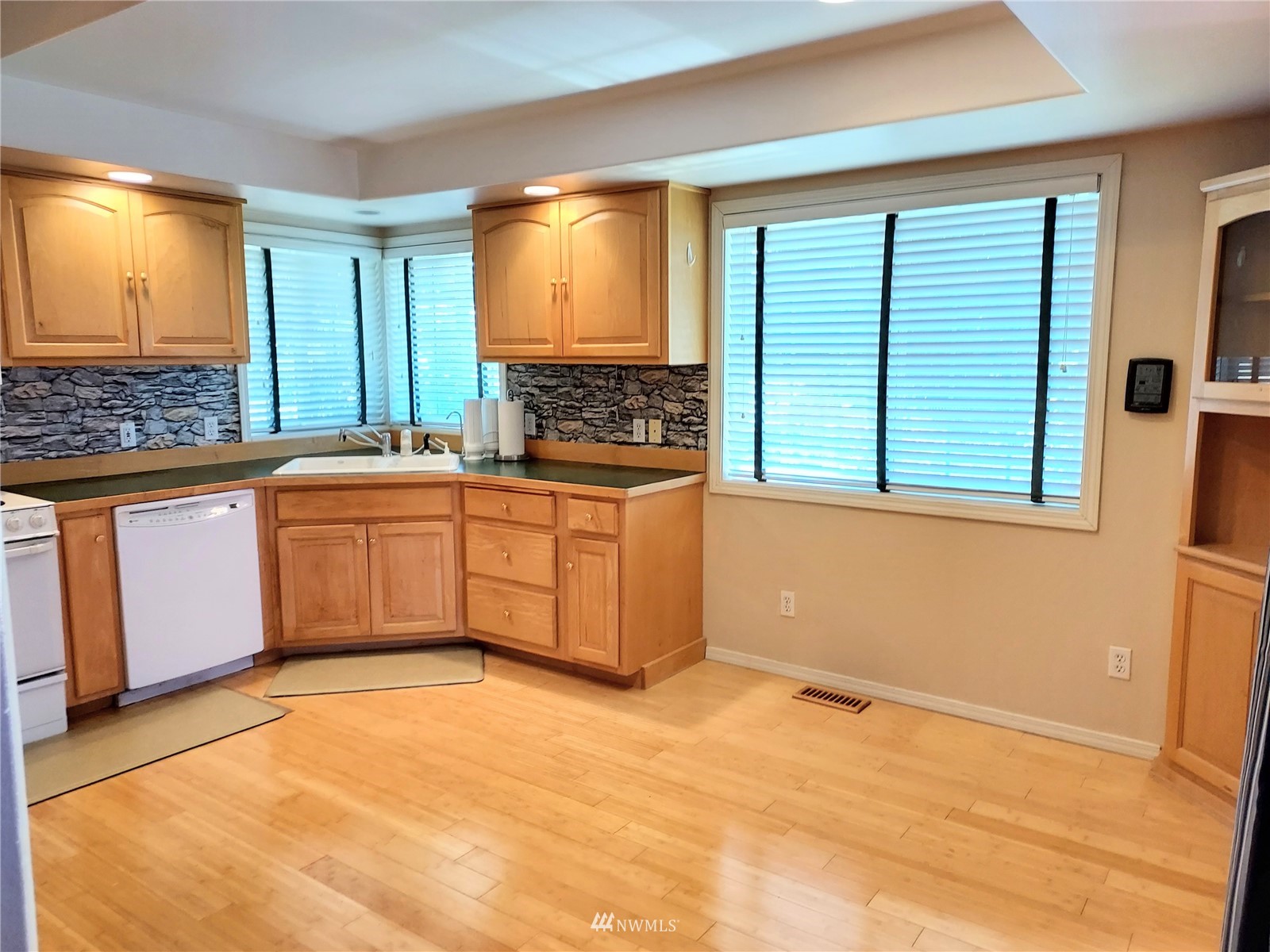 150 Donaper Road Sequim, WA 98382 - Photo 9 of 25 a kitchen with stainless steel appliances granite countertop a sink stove and cabinets