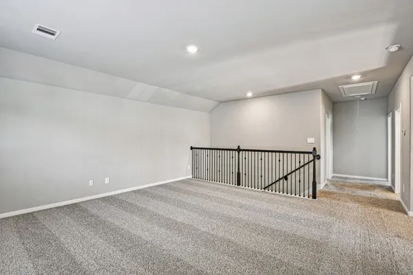 a living room with furniture couches and a flat screen tv