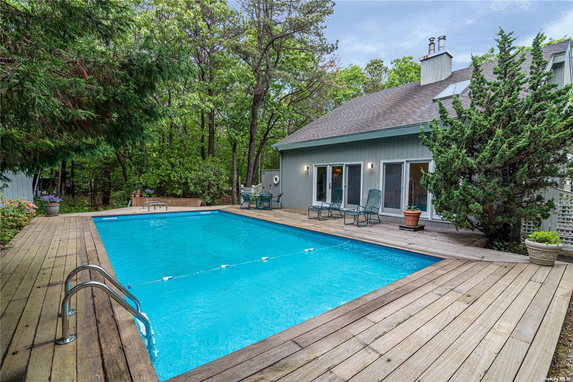 7 Quantuck Bay Road Westhampton Beach, NY 11978 - Photo 1 of 1 a view of outdoor space yard swimming pool and porch