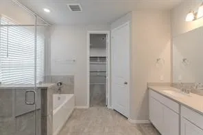 a bathroom with a bathtub and a sink