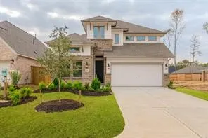 a large white kitchen with kitchen island a sink appliances and a counter top space