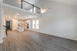 a view of a room with wooden floor
