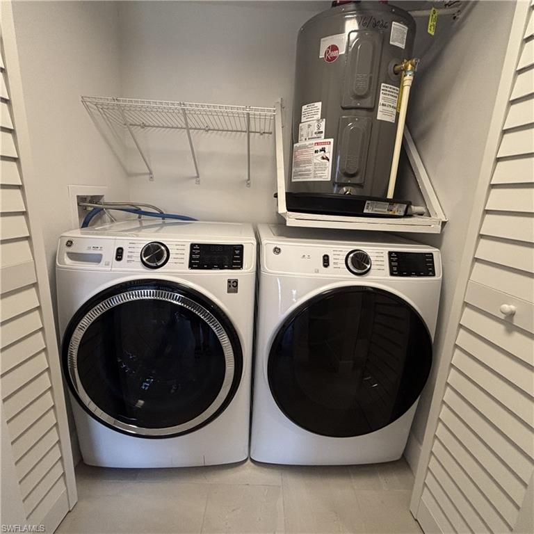 5319 Summerlin Road, Unit 1916 Fort Myers, FL 33919 - Photo 5 of 8 a utility room with dryer and washer