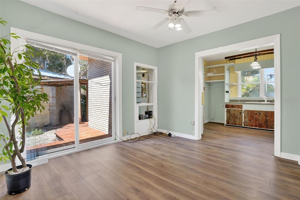 7970 Bannon Fish Camp Road Haines City, FL 33844 - Photo 12 of 73 a view of an empty room with a window and wooden floor