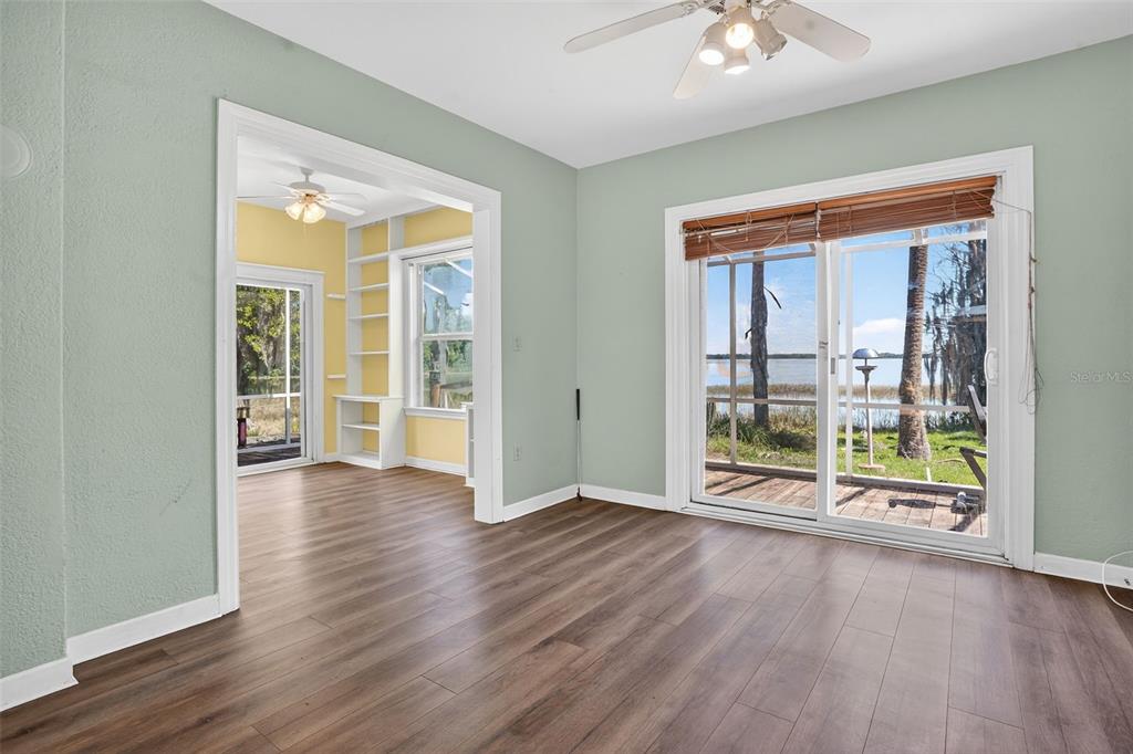 7970 Bannon Fish Camp Road Haines City, FL 33844 - Photo 13 of 73 wooden floor in an empty room with a window