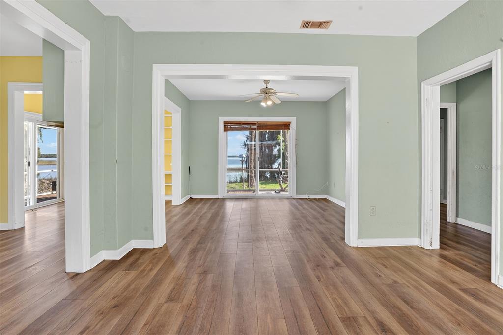 7970 Bannon Fish Camp Road Haines City, FL 33844 - Photo 14 of 73 wooden floor in an empty room with a window