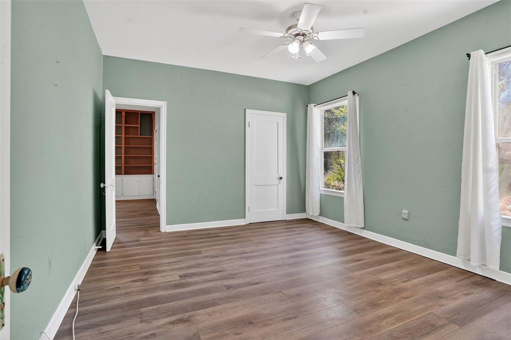7970 Bannon Fish Camp Road Haines City, FL 33844 - Photo 17 of 73 a view of an empty room with wooden floor