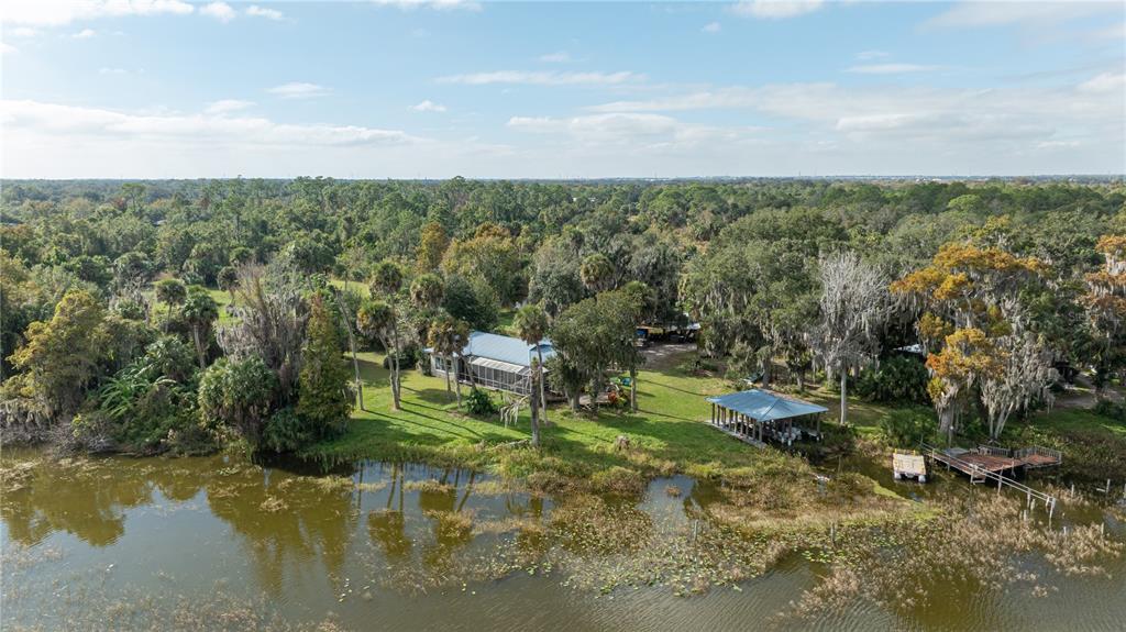 7970 Bannon Fish Camp Road Haines City, FL 33844 - Photo 22 of 73 a view of a lake with houses in back