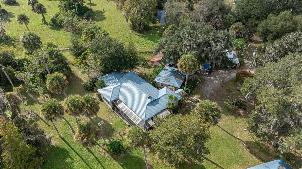 7970 Bannon Fish Camp Road Haines City, FL 33844 - Photo 26 of 73 an aerial view of a house with a yard