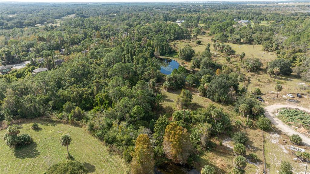 7970 Bannon Fish Camp Road Haines City, FL 33844 - Photo 29 of 73 an aerial view of residential houses with outdoor space