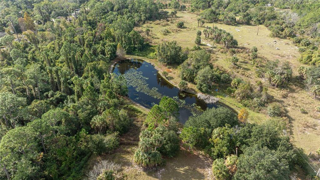 7970 Bannon Fish Camp Road Haines City, FL 33844 - Photo 30 of 73 an aerial view of residential house with outdoor space and trees all around