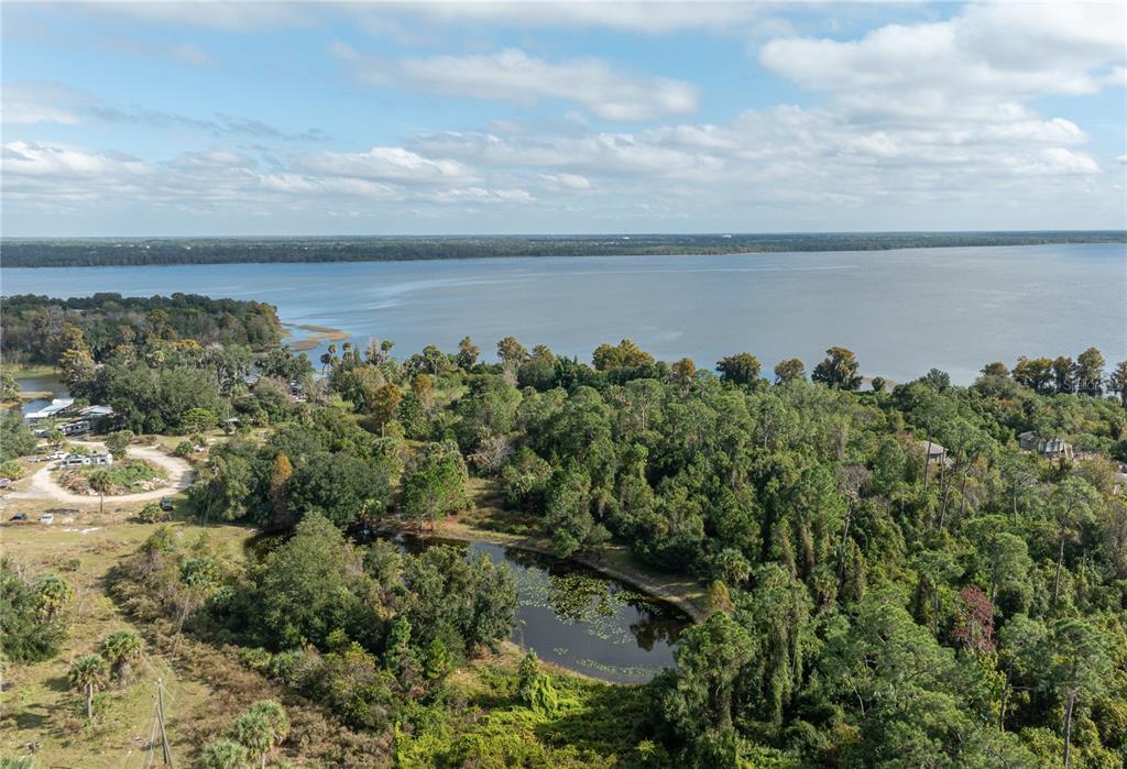 7970 Bannon Fish Camp Road Haines City, FL 33844 - Photo 31 of 73 an aerial view of a houses with yard and lake view