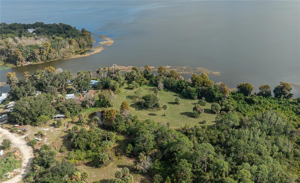 7970 Bannon Fish Camp Road Haines City, FL 33844 - Photo 36 of 73 an aerial view of a house with a yard