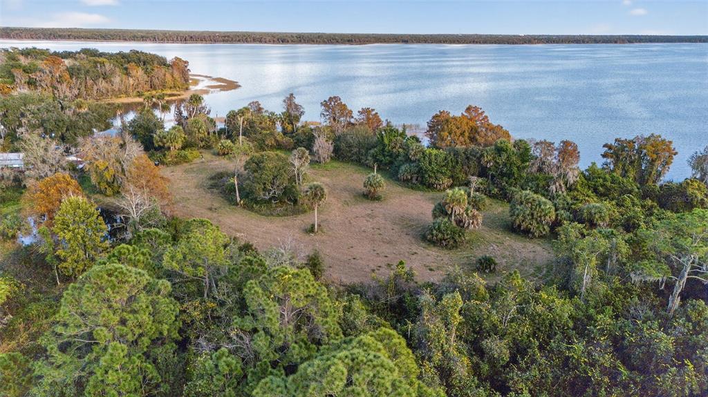 7970 Bannon Fish Camp Road Haines City, FL 33844 - Photo 45 of 73 a view of a lake with a mountain in the back