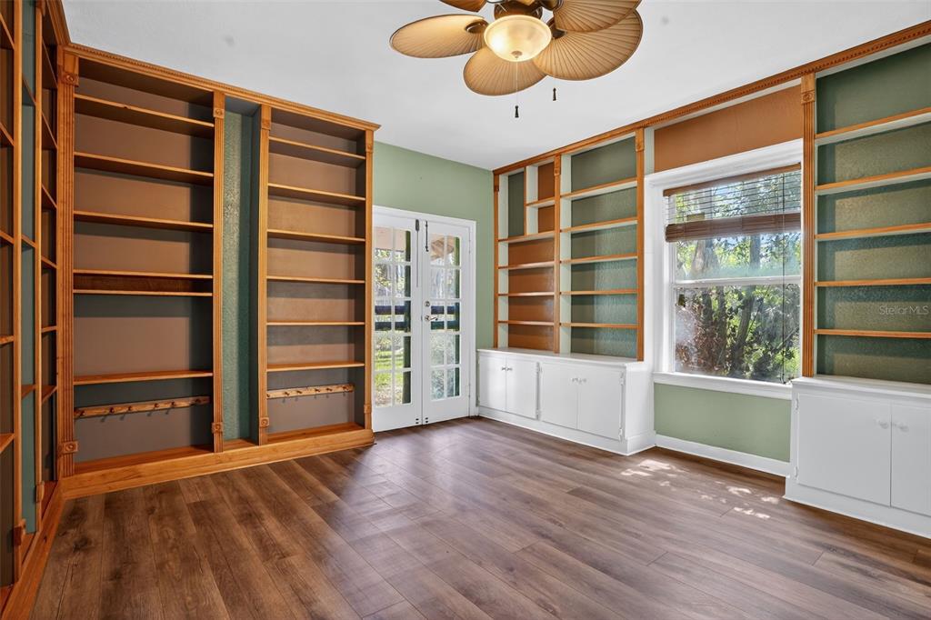 7970 Bannon Fish Camp Road Haines City, FL 33844 - Photo 5 of 73 a view of an empty room with a window and wooden floor