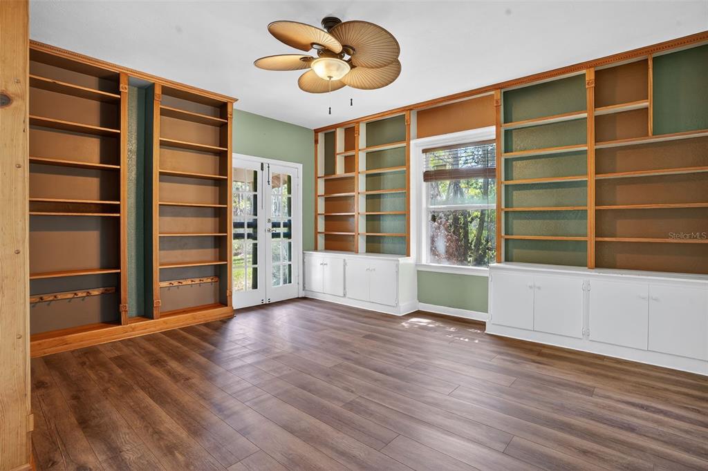 7970 Bannon Fish Camp Road Haines City, FL 33844 - Photo 62 of 73 a view of an empty room with a window and wooden floor