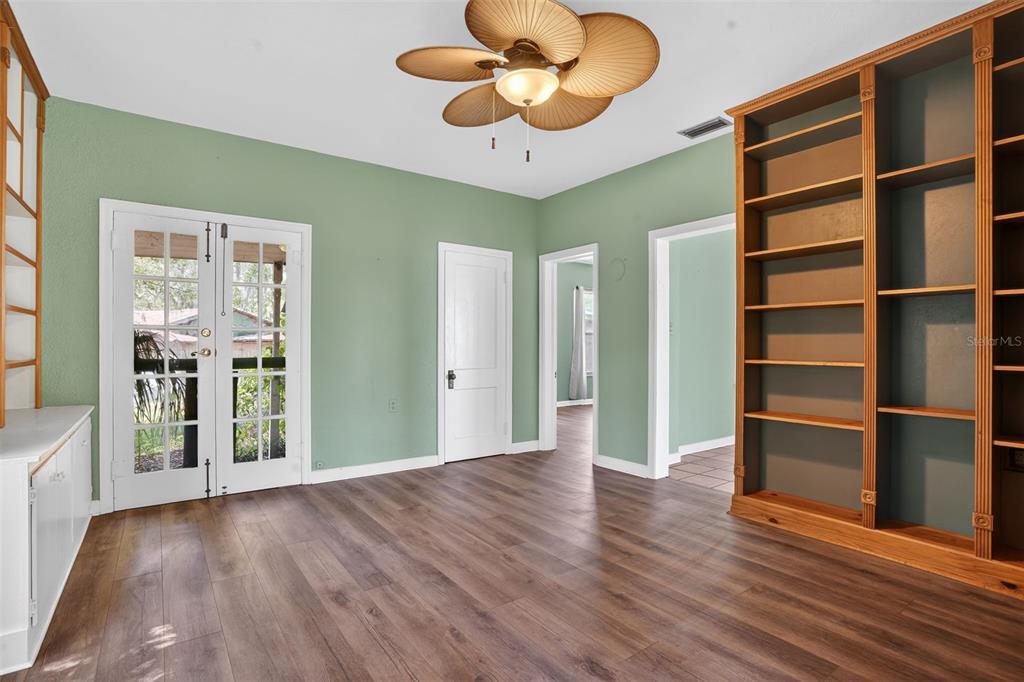 7970 Bannon Fish Camp Road Haines City, FL 33844 - Photo 66 of 73 a view of an empty room with a window and wooden floor