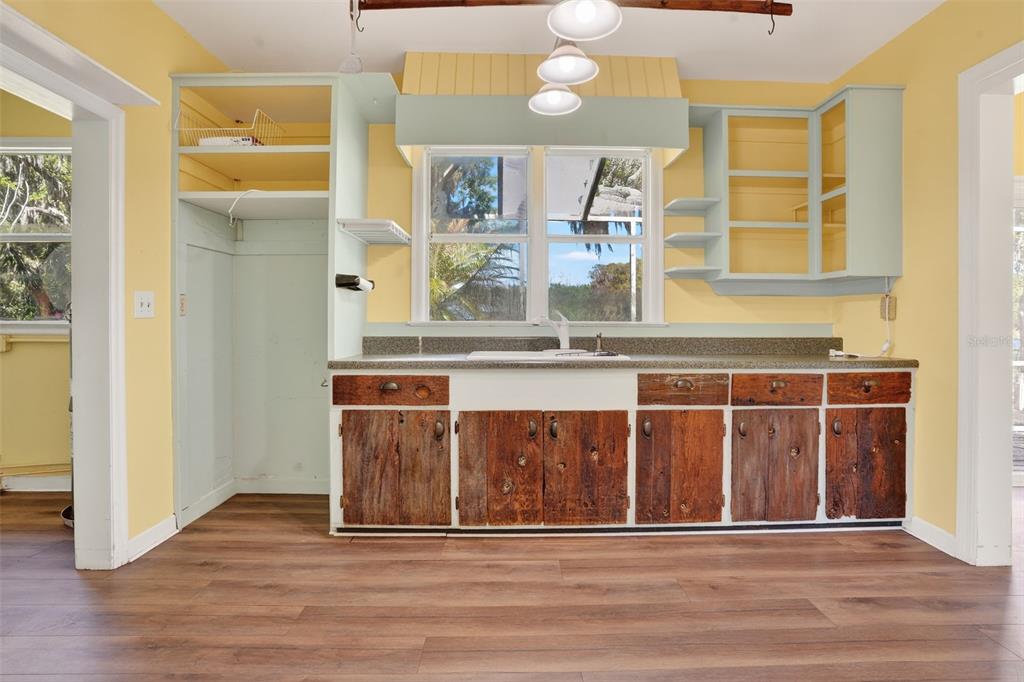 7970 Bannon Fish Camp Road Haines City, FL 33844 - Photo 9 of 73 a view of a kitchen with stainless steel appliances granite countertop a stove and a white cabinets