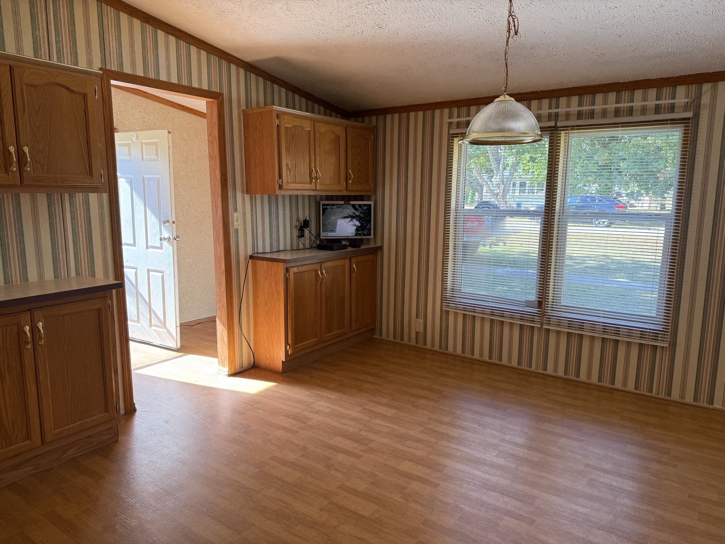 502 3rd Street West Lyndon, IL 61261 - Photo 11 of 11 a view of a kitchen with a stove wooden floor and a window