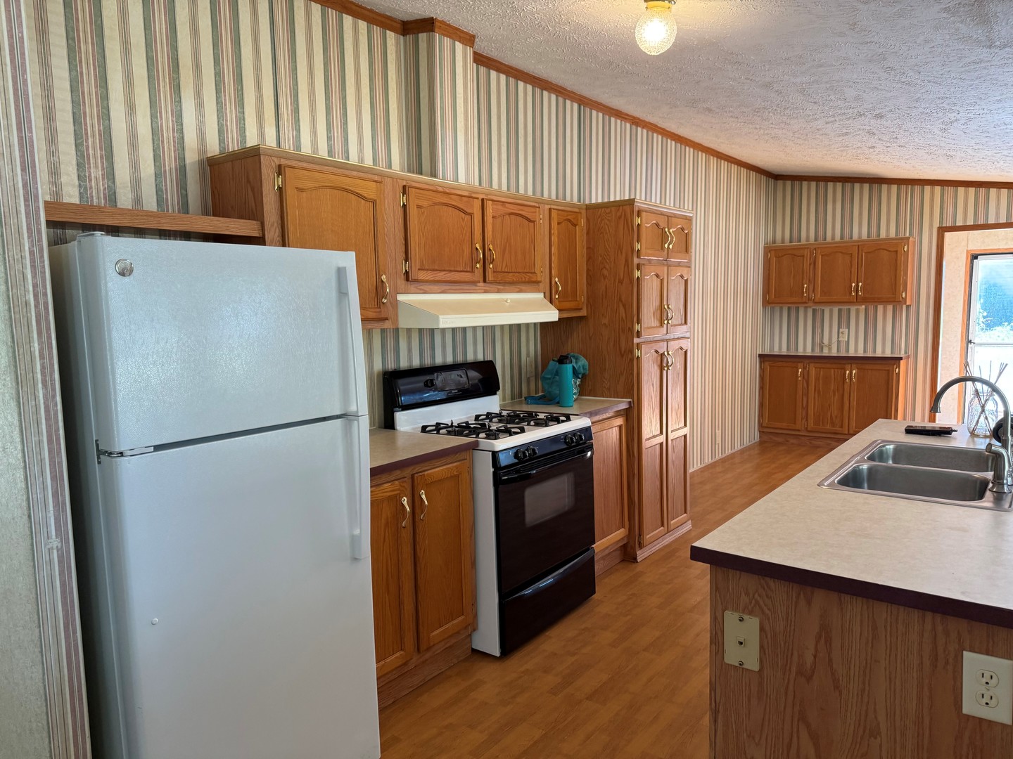 502 3rd Street West Lyndon, IL 61261 - Photo 2 of 11 a kitchen with stainless steel appliances granite countertop a refrigerator a sink a stove and a refrigerator