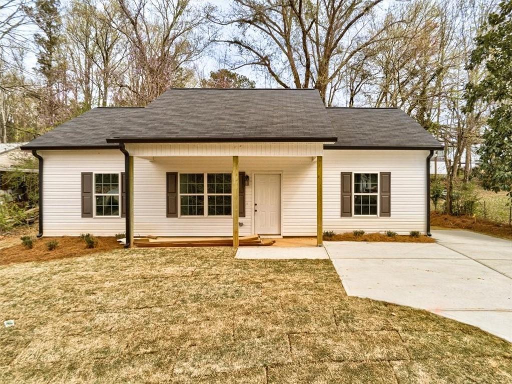 a house with yard in front of it