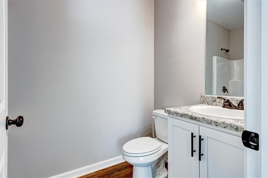 201 Loftis Road Temple, GA 30179 - Photo 11 of 14 a bathroom with a sink toilet and mirror