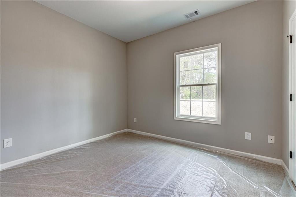 201 Loftis Road Temple, GA 30179 - Photo 13 of 14 an empty room with a window