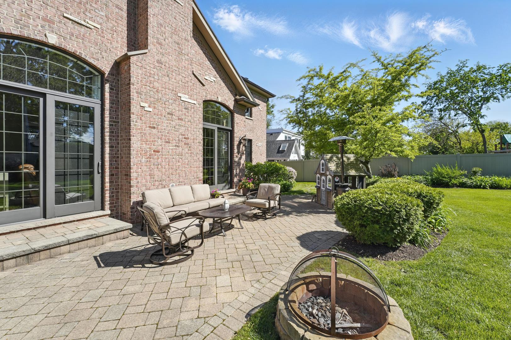 610 Greendale Road Glenview, IL 60025 - Photo 44 of 52 a swimming pool with outdoor seating and garden