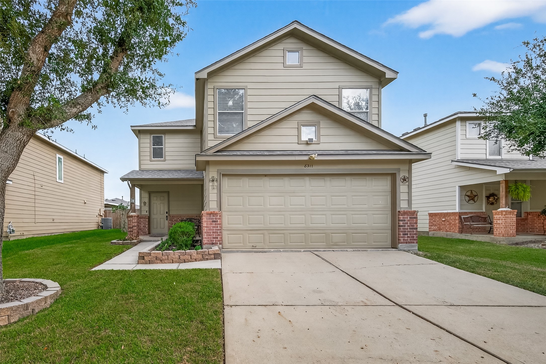 8311 Tartan Court Rosharon, TX 77583 - Photo 2 of 48 a front view of a house with garden