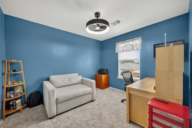 a living room with furniture and a table
