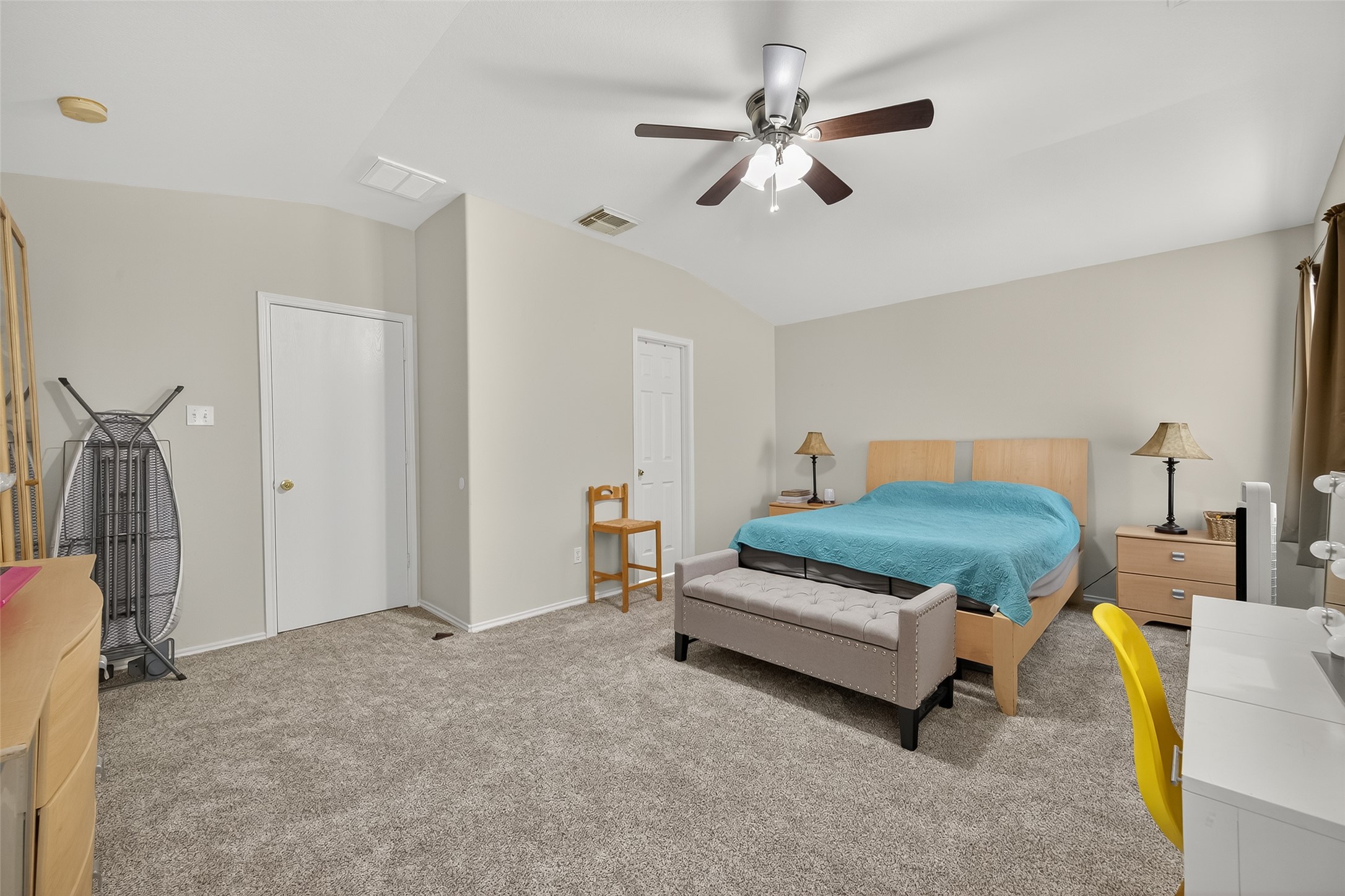 8311 Tartan Court Rosharon, TX 77583 - Photo 32 of 48 a bedroom with a bed and a chandelier