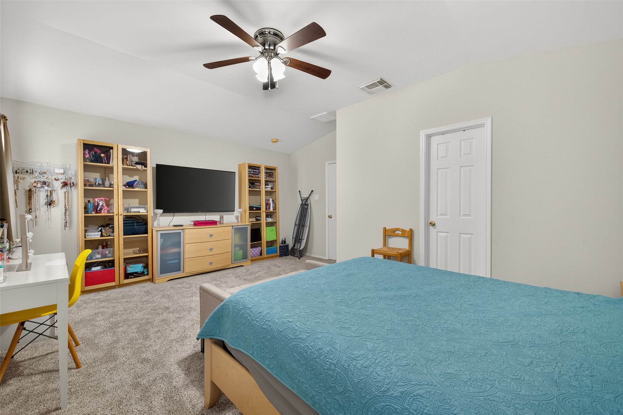 8311 Tartan Court Rosharon, TX 77583 - Photo 33 of 48 a bedroom with a bed and a flat screen tv