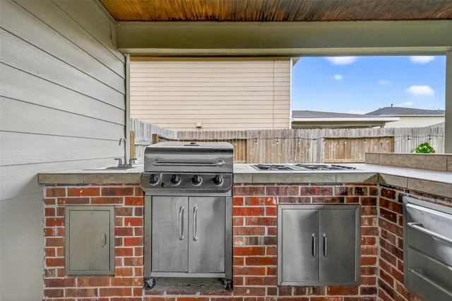 a stove top oven sitting inside of a kitchen