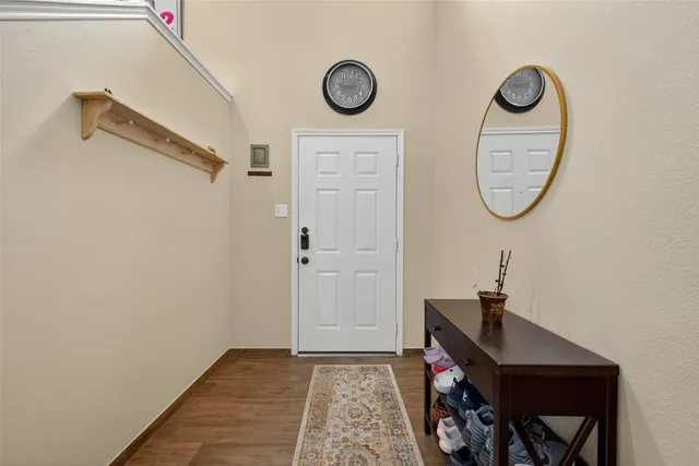 a bathroom with a table and a mirror