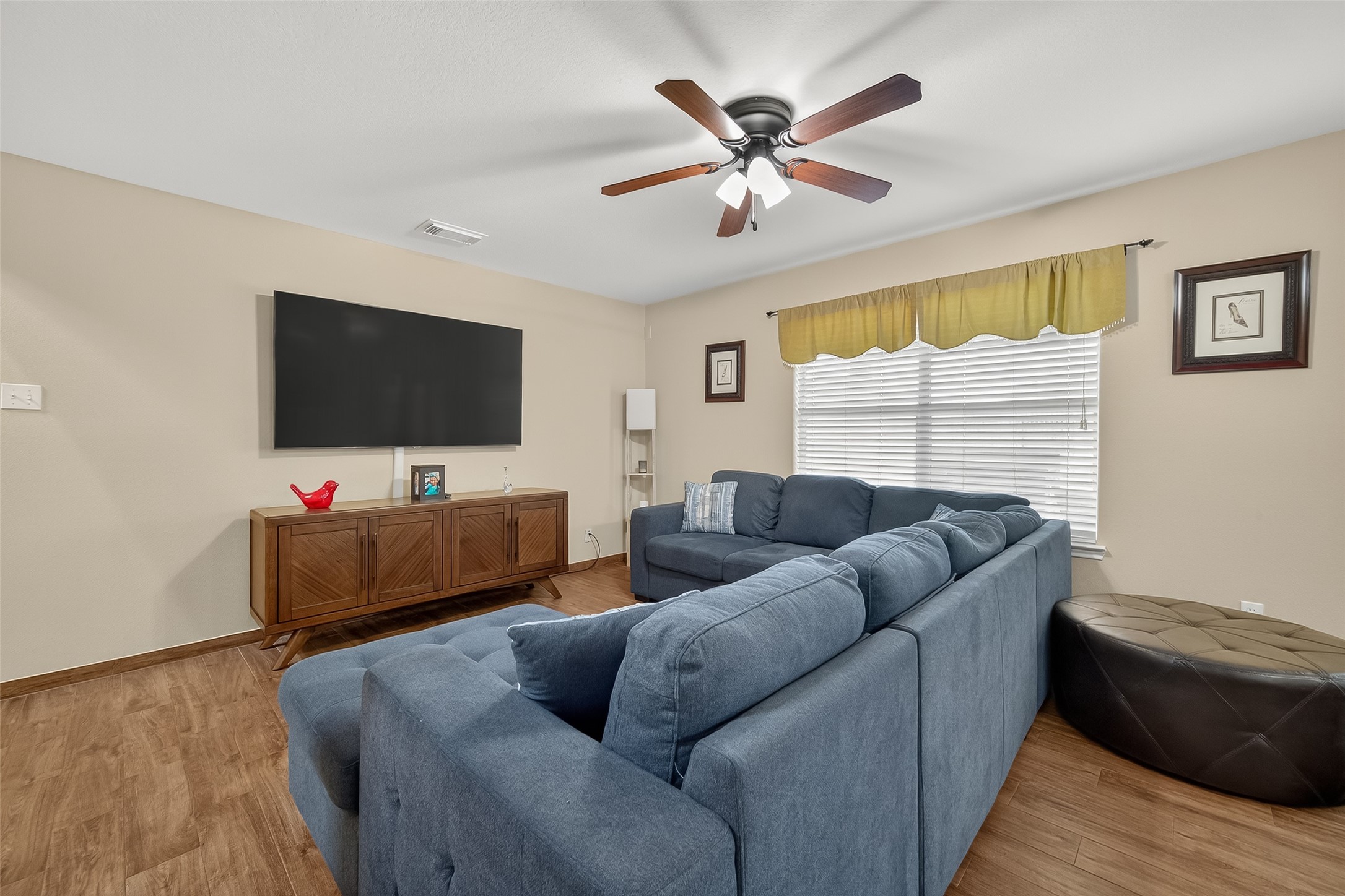 8311 Tartan Court Rosharon, TX 77583 - Photo 10 of 48 a living room with furniture and a flat screen tv
