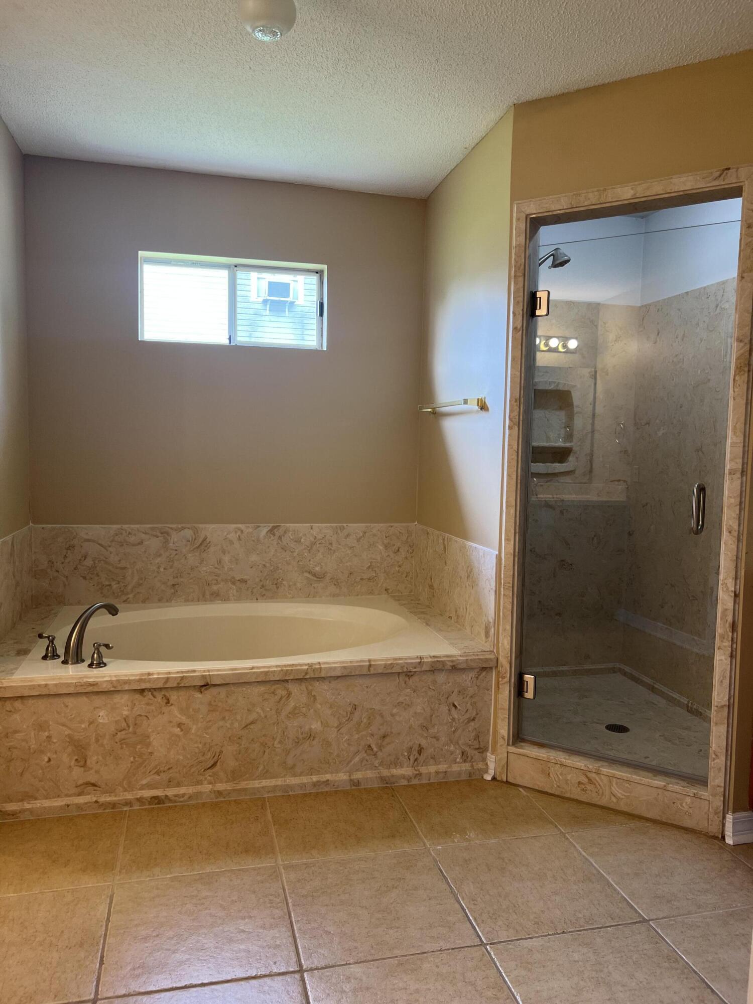 159 Nun Drive Crestview, FL 32536 - Photo 14 of 27 a bathroom with a bathtub and a shower