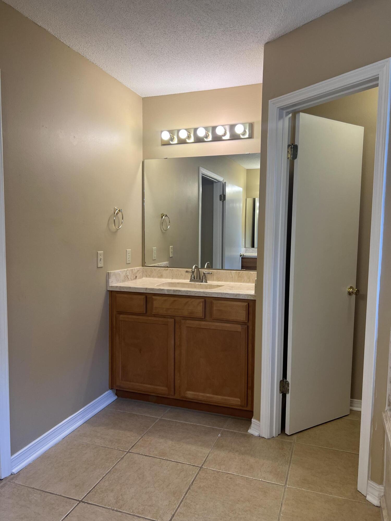 159 Nun Drive Crestview, FL 32536 - Photo 16 of 27 a bathroom with a sink and a mirror