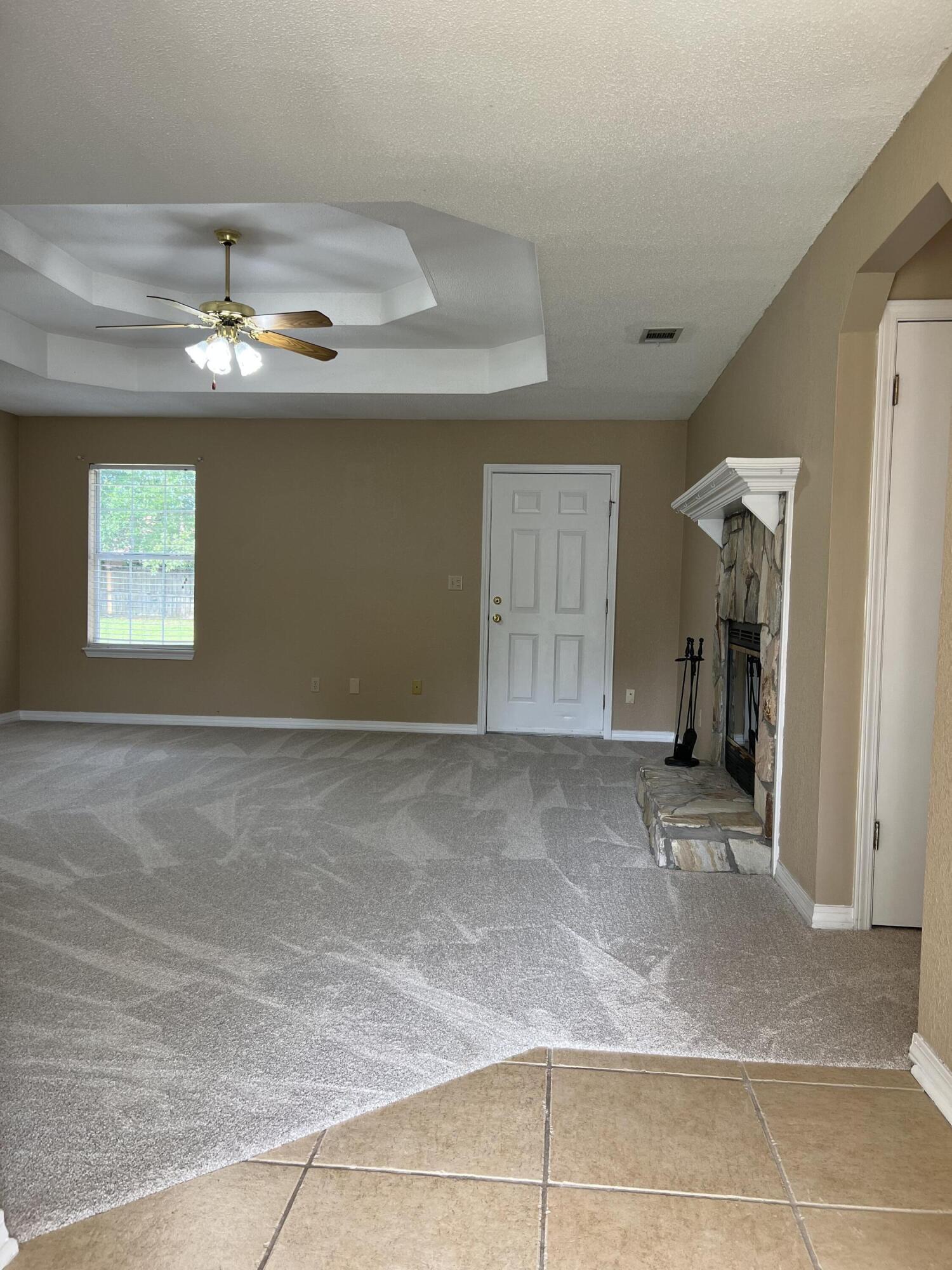 159 Nun Drive Crestview, FL 32536 - Photo 2 of 27 a view of a livingroom with a chandelier fan and windows