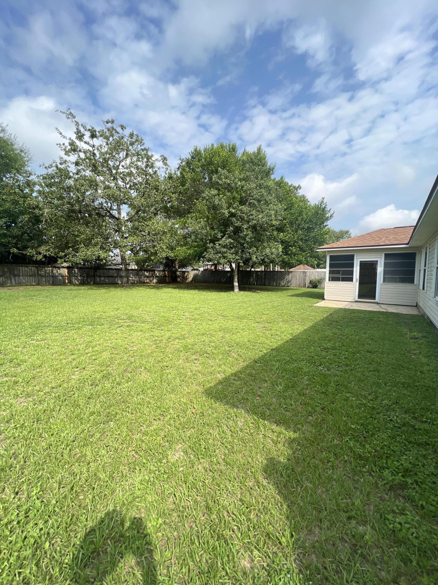 159 Nun Drive Crestview, FL 32536 - Photo 26 of 27 a view of a house with a big yard