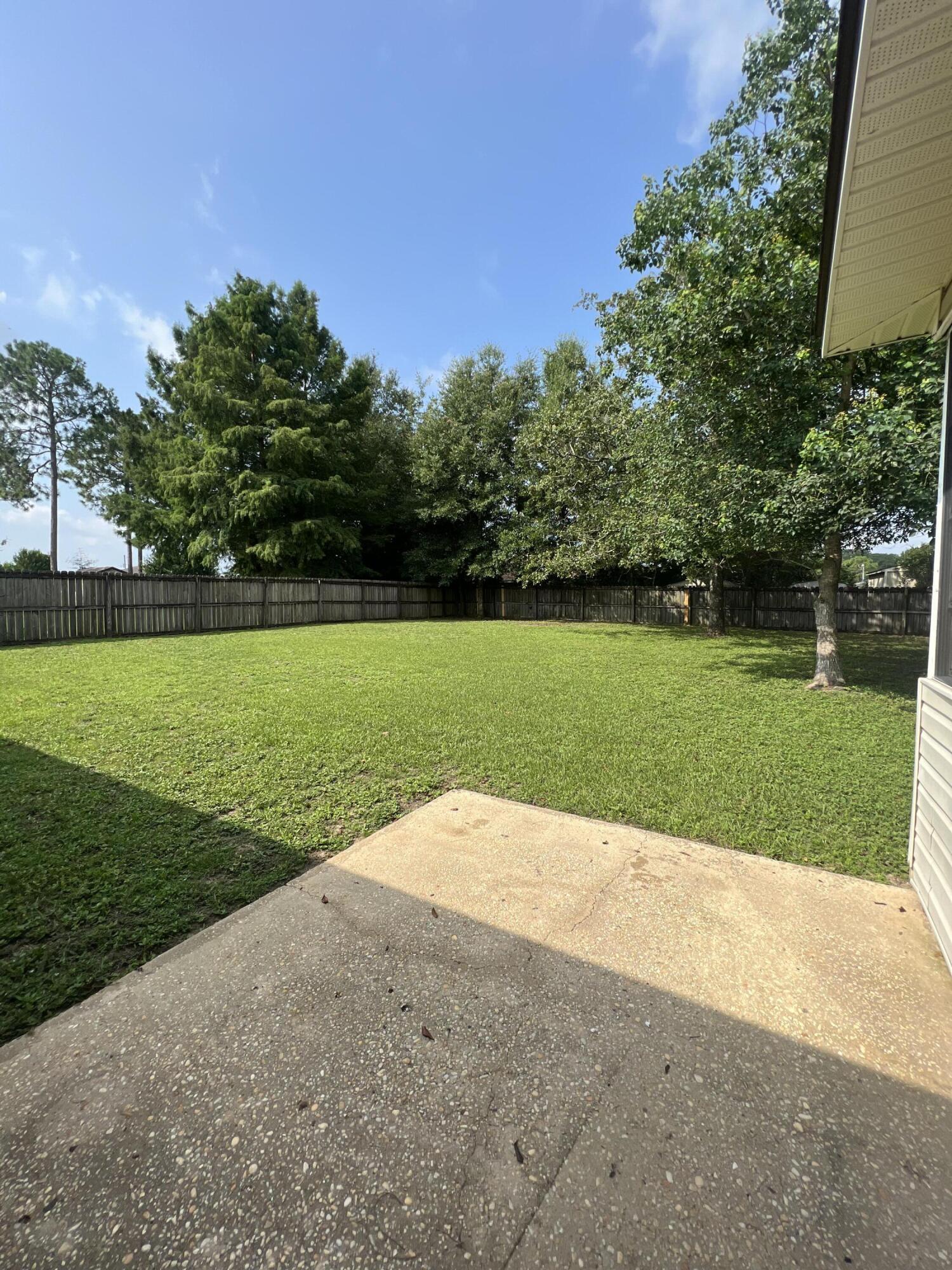 159 Nun Drive Crestview, FL 32536 - Photo 27 of 27 a view of a park with a trees in the background