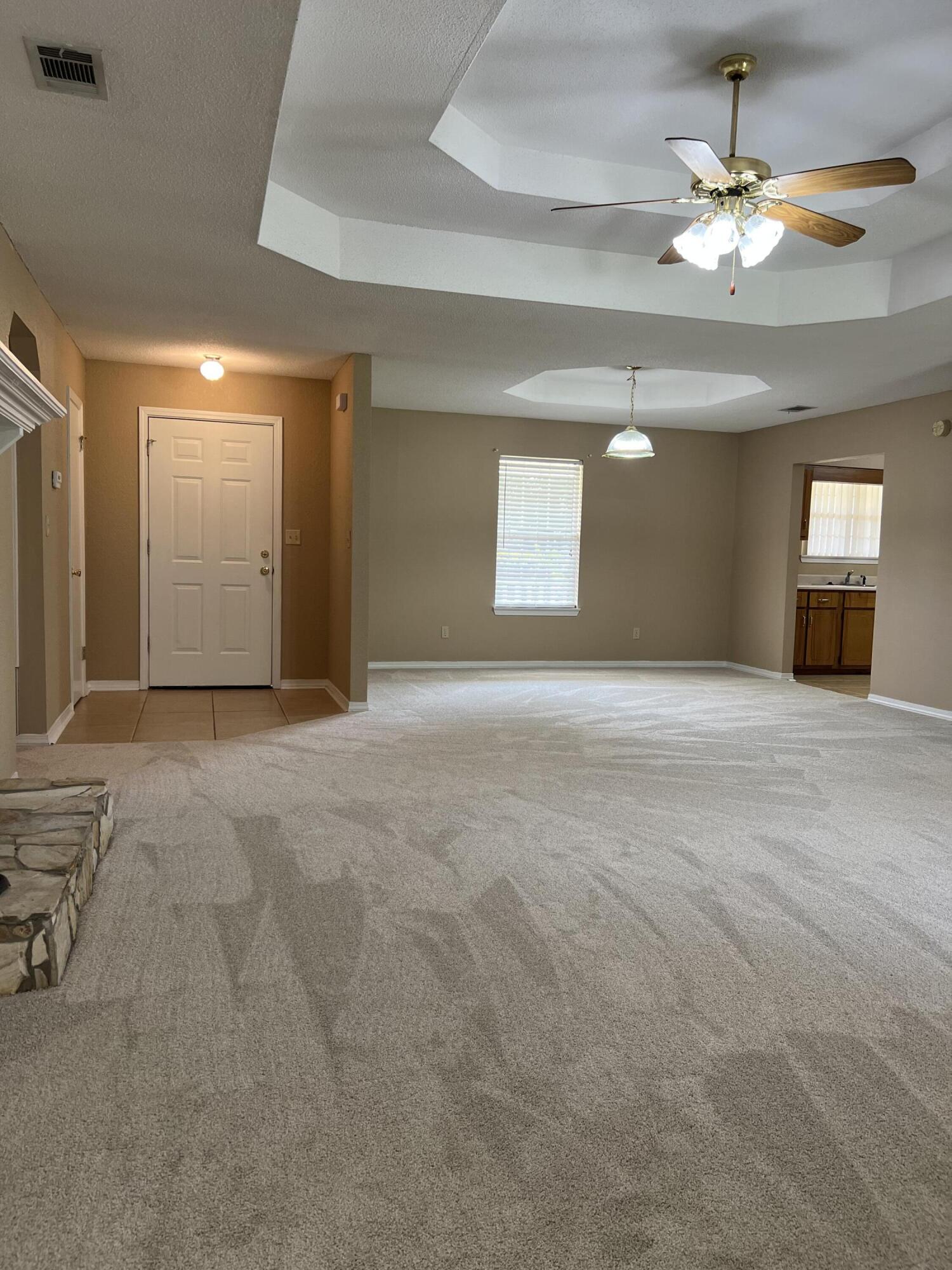 159 Nun Drive Crestview, FL 32536 - Photo 4 of 27 a view of a livingroom with a ceiling fan and window