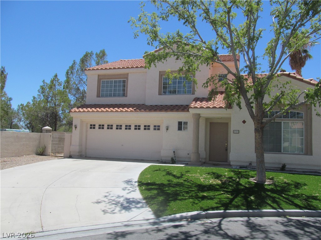 8701 Crescent Ridge Lane Las Vegas, NV 89134 - Photo 1 of 28 A well-maintained stucco exterior with a tiled roof provides inviting curb appeal.