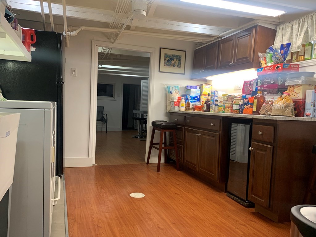35 5th Street Medford, MA 02155 - Photo 15 of 42 a kitchen with stainless steel appliances granite countertop a refrigerator and a stove