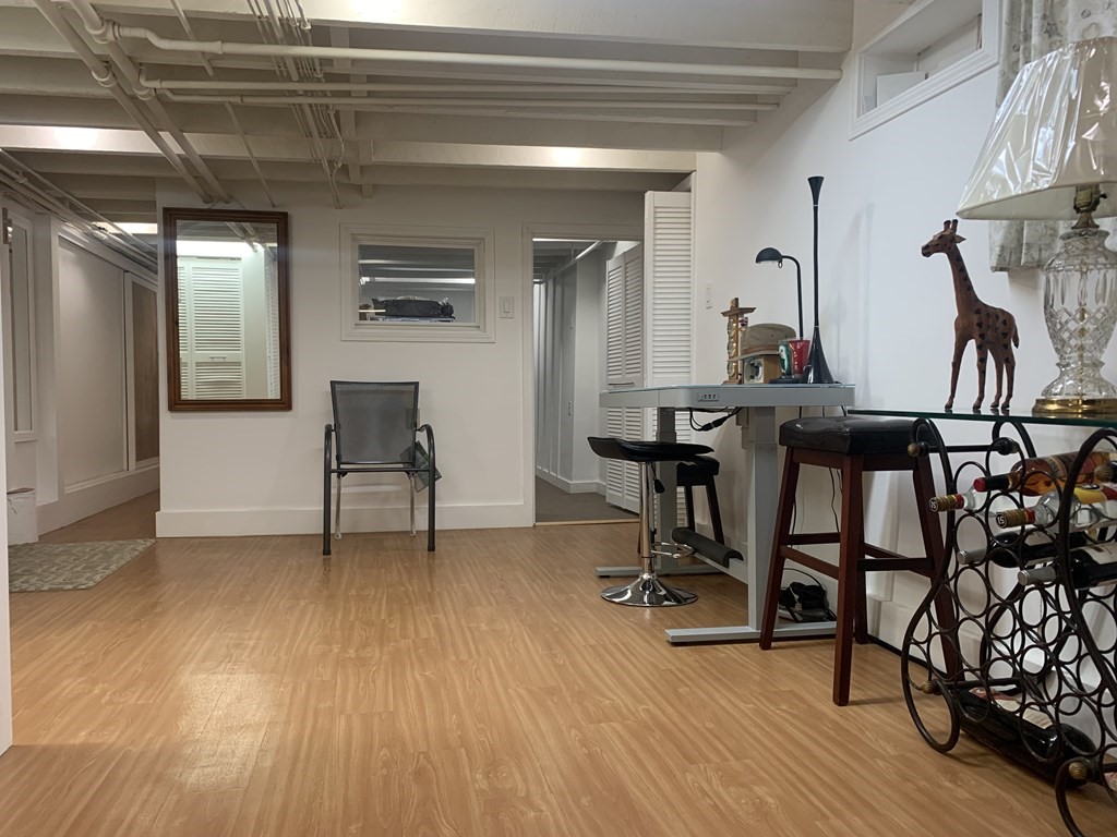 35 5th Street Medford, MA 02155 - Photo 17 of 42 a view of a livingroom with furniture and a wooden floor