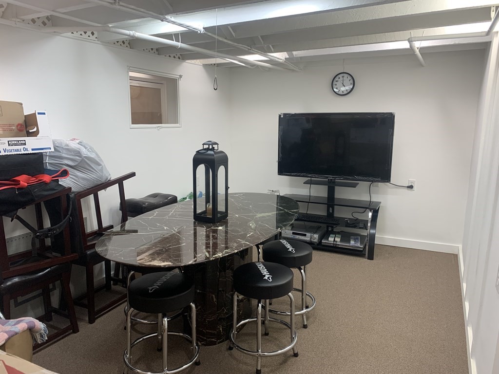 35 5th Street Medford, MA 02155 - Photo 19 of 42 a dining room with furniture and wooden floor