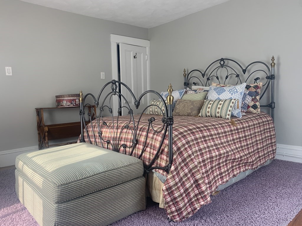35 5th Street Medford, MA 02155 - Photo 21 of 42 a bedroom with bed and a table