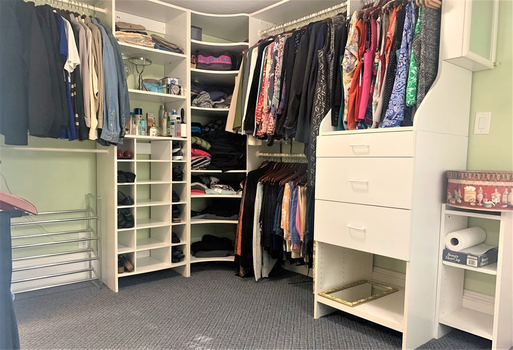 35 5th Street Medford, MA 02155 - Photo 26 of 42 a view of walk in closet with clothes and shoes